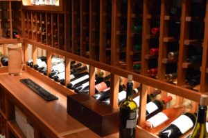 Inclined Wine Cellar Racking Display Row with Label-Forward Wine Bottles with Lighting