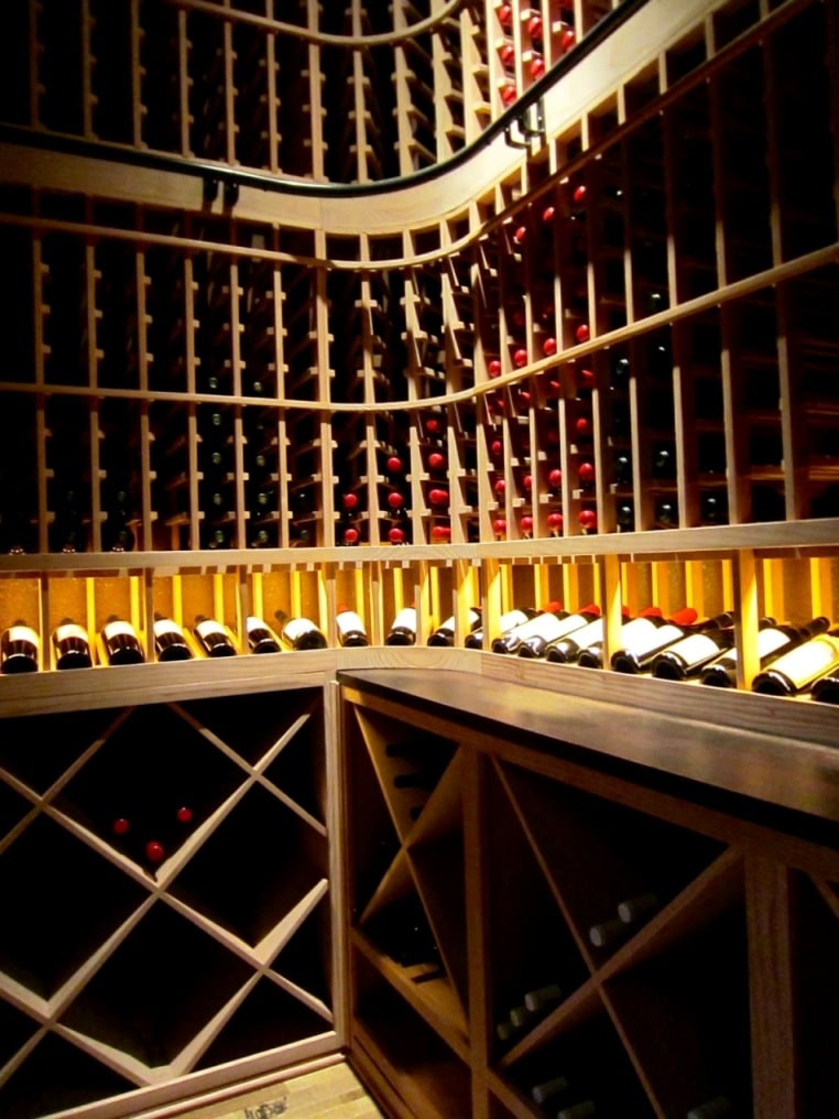 Wooden wine racks installed in a home wine cellar by Las Vegas Builders