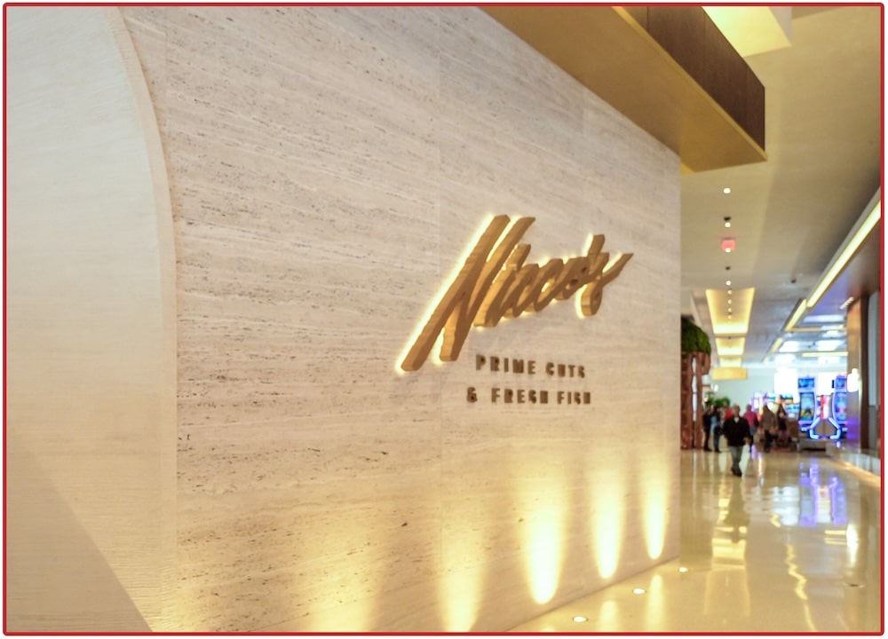 Entrance to Nico's steakhouse with a luxury restaurant wine cellar