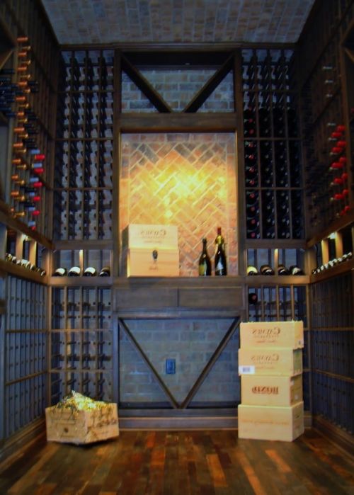 Custom Traditional Wine Cellar with Wooden Wine Racks and Oak Flooring