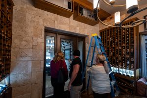 8 - Guest Peeking at the Entrance of the Residential Wine Cellars in Summerlin, Las Vegas