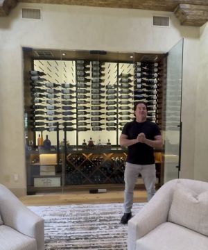 1 - glass-enclosed Wine Cellar: A Striking Centerpiece in a Las Vegas Home Modern glass wine cellar with LED lighting in Las Vegas luxury home