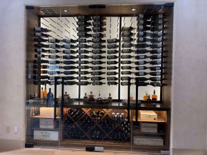 5 - Glass-Enclosed Wine Rooms with Defined Metal Wine Racking