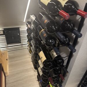 8 - A masterclass in maximizing under-the-stairs space. This small wine cellar uses a dual-rack layout to allow both showcase and storage—perfect for serious collectors in compact homes.